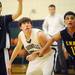 Greenhills senior Michael Kaspark waits at the foul line flanked by Eastern Washtenaw Multicultural senior Yasser Farha and sophomore Momin Malin during the second half at Greenhills on Thursday. Melanie Maxwell I AnnArbor.com